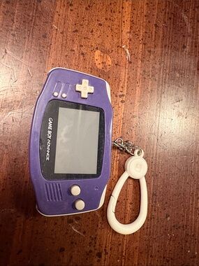 Purple Handheld Game Console - Classic Portable Gaming